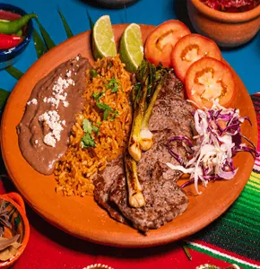 Carne Asada — grilled marinated beef with Mexican rice